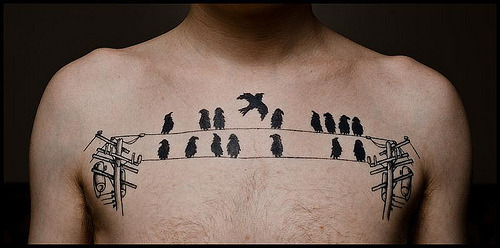 Check out this very clever tattoo by Steve Losh.The birds represent 1's.