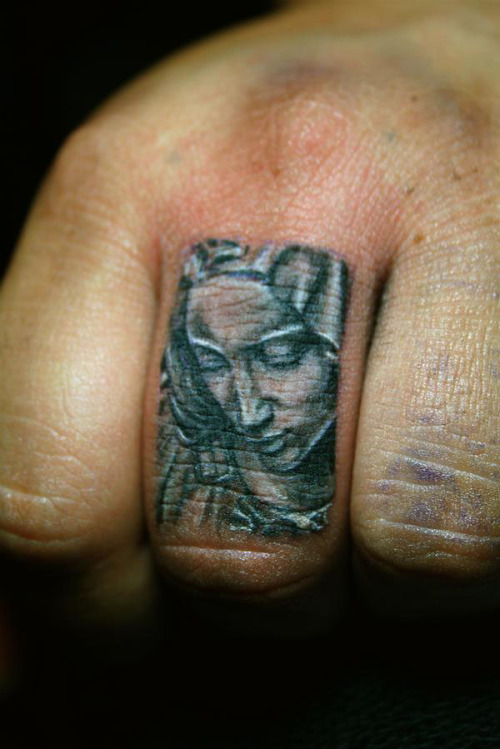NET finger tattoos take time and sometimes multiple touch-