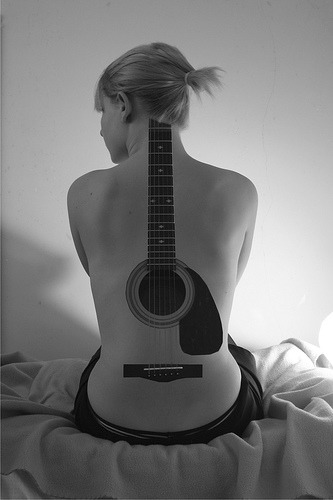 scodal Well it's settled acoustic guitar tattoo on the back is the coolest