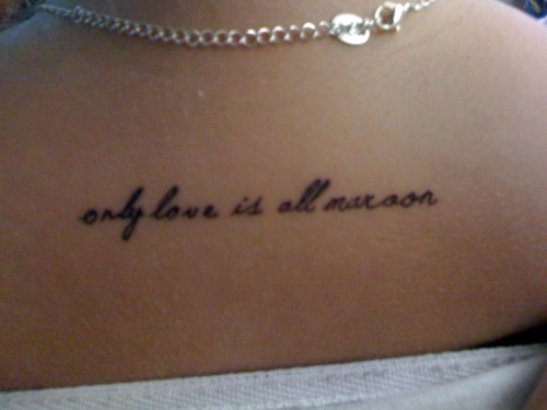 my first tattoo it says only love is all maroon a quote from my favorite 
