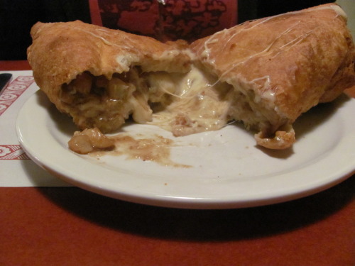 Canadian Calzone Poutine (fries, cheese &amp; brown gravy) cooked inside a calzone and deep fried. (submitted by Caoer Jess)