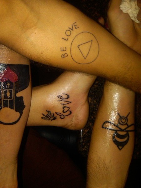 Jason, Tricia, Bushwalla, and John's “Be Love” tattoos.