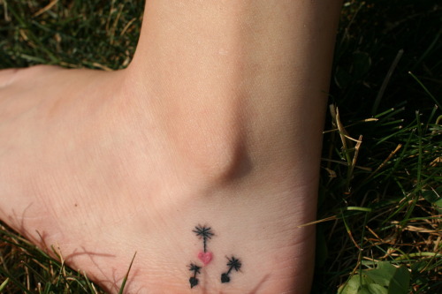 This is my first tattoo I got the seedlings that fly off of a dandelion 