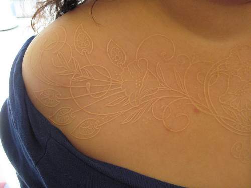White ink tattoo (from Shannon Archuleta) I think a lace pattern tattoo