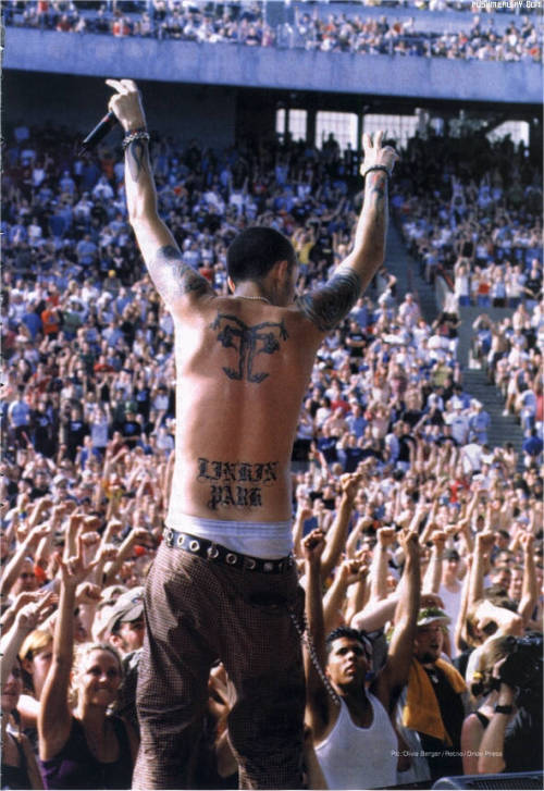 Showing off the lovely Linkin Park tattoo on his back. &lt;3