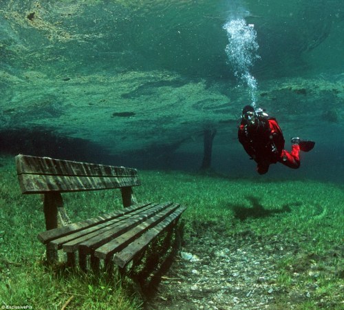 Divers explore pristine alpine park that turns into a lake for half the 