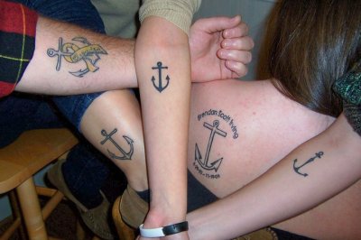 A year ago, November 19, 2009, a friend very close to those photoed above took his life. He had an anchor tattoo, so it seemed a sensible memorial for him. The anchors also symbolize the fact that we are all now each others anchors to get through the tough times. This photo is missing three anchors, one of his best friends, ex girlfriend, and his original tattoo.  Love you so much, Brendan, rest in so much peace.  I hope you’d be proud, boy.