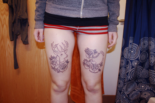 They have tattoo outlines on each of their thighs a deer head on one 