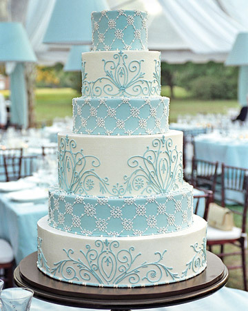 Aqua and white wedding cake with beautiful flourishes it 8217s almost 
