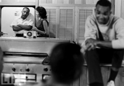 From Life Magazine, new pictures of Martin Luther King, Jr:

It is the spring of 1961, and in the kitchen of a safe house in 
Montgomery, Alabama, the Reverend Dr. Martin Luther King Jr. looks 
tense, perhaps worried. As a volunteer bends his ear, the 32-year-old 
civil rights leader glances toward one of the 17 students hunkered down 
with him — fresh-faced college kids who, moved by King’s message of 
racial equality, have risked their very lives. The past two weeks have 
been harrowing for these young people — the “Freedom Riders,” they are 
called — as they inch across the state on integrated buses, their 
numbers diminished at every stop in the face of arrests, bloody mob 
beatings, fire-bombings. There to capture the mood in the room as the 
group plans its next brave move — a ride into Jackson, Mississippi — is 
LIFE photographer Paul Schutzer, who covered the “Prayer Pilgrimage for 
Freedom” four years earlier and had seen firsthand the kind of courage 
and determination King could inspire in his followers. Now, nearly 50 
years after these Freedom Rides and in celebration of King’s 
birthday, LIFE.com presents never-seen photos taken by Schutzer, 
tracking King and the nation-changing movement he led, from the 
monuments of Washington to the streets of the Deep South.
NEVER-SEEN: MLK & the Freedom Rides