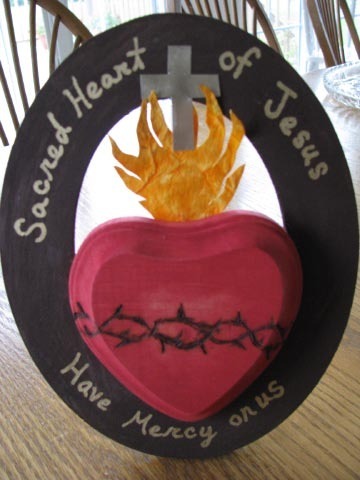 Sacred Heart Craft
My husband and I teach a Sunday Religious Education class.  Our sixth graders have been doing a lot of bookwork/worksheets recently so I’ve been wanting to do a craft with them to spice things up.  Since Monday is Valentine’s Day, I decided that we would do a Sacred Heart craft.  I’m not very good at coming up with my own crafts, but I can follow directions, so I searched the internet hoping to find something, and this is what I found!  Isn’t it great?  David and I will go buy the supplies and try it out this Saturday, and as long as it goes well, our students will be making these on Sunday (as well as getting a lesson on the Sacred Heart). 
For the full post and directions how to make this (and an amazing blog altogether), go visit Kimberlee at Pondered in my Heart.