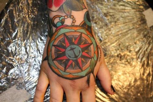 Compass rose tattoo by Hakan Handgranat