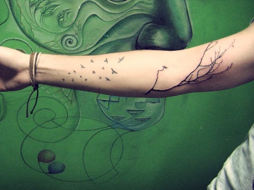 mine vein tree branch with birds tattoo