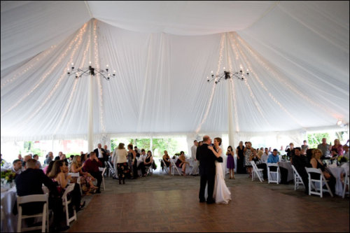 3000 yards of fabric create an elegant outdoor tented wedding