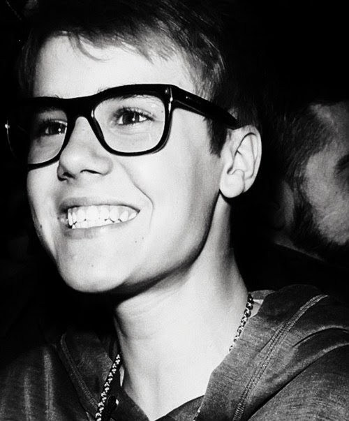 justin bieber smiling with glasses. justin bieber with glasses