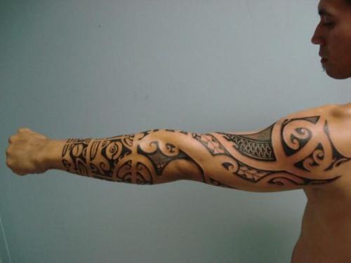 Polynesian sleeve and what it looks like to me near the wrist is Maori