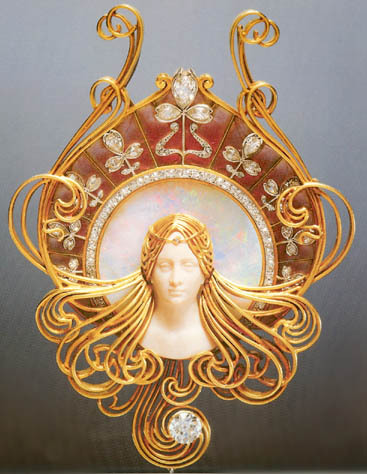 “Rene Lalique became one of France’s leading jewelers in the art nouveau style. He designed very ornate jewelry and headdresses for the actress Sarah Bernhardt.  She wore his jewelry on stage as costumes and off stage as her own personal collection.”