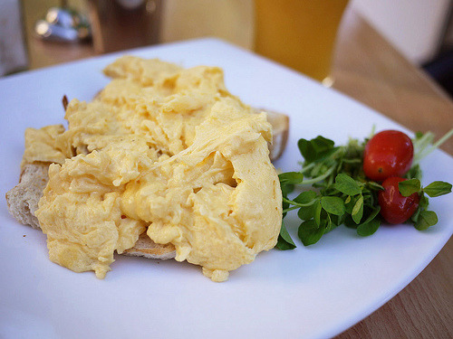 lovelylovelyfood:

Scrambled Eggs Over Toast With Cherry Tomatoes and Greens 
