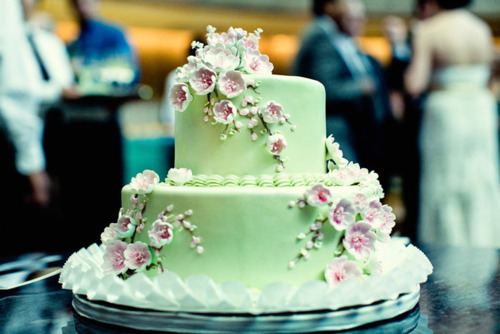 What a beautiful color scheme on that wedding cake The soft pastel green is 