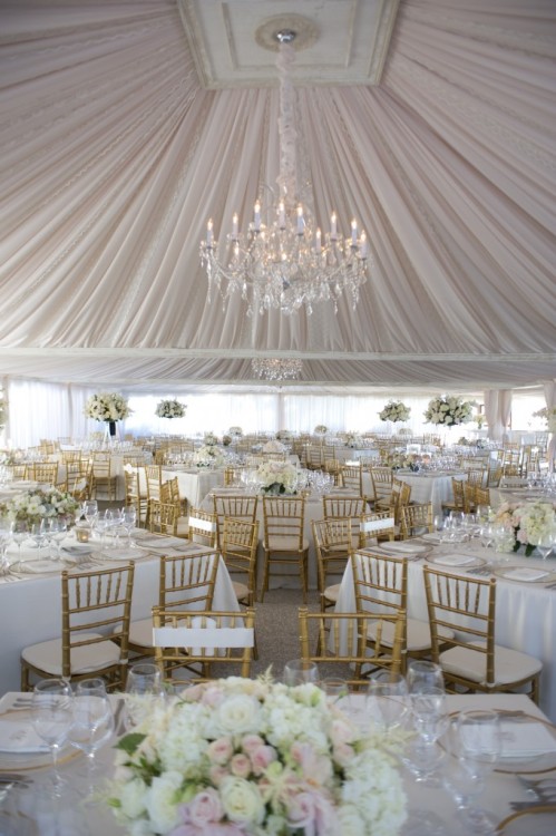 Dramatically draped tent for a wedding reception via Experiences by Kristin