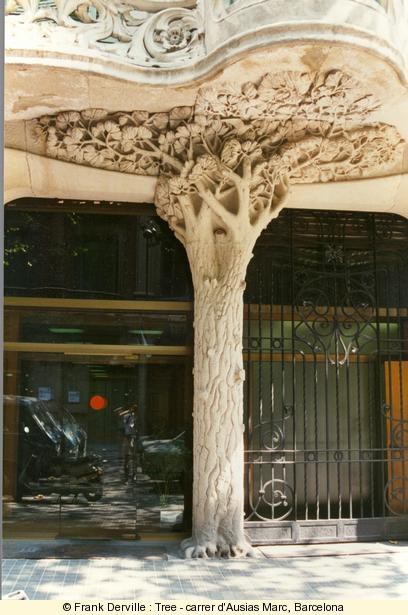 An Art Nouveau column resembles a real tree on this Barcelona building via
