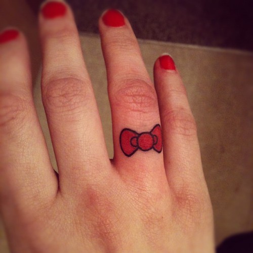 Hello Kitty bow because I like HK and wanted a cute finger tattoo Simple