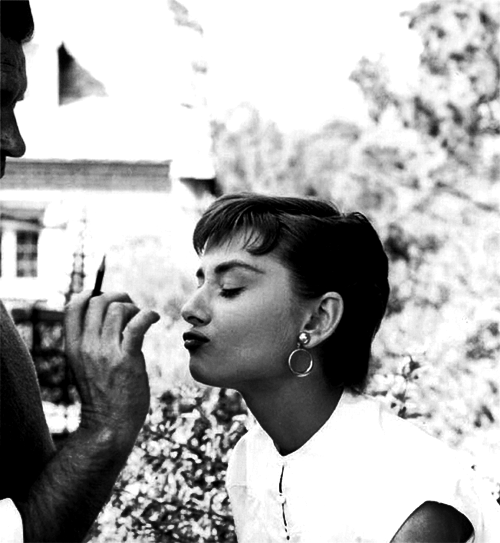 Audrey Hepburn gets her makeup retouched on the set of Sabrina 1954 
