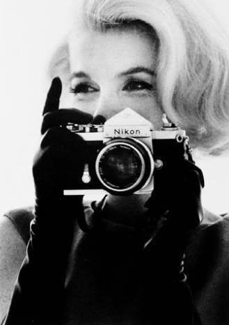 Marilyn Monroe with Nikon Camera by Bert Stern