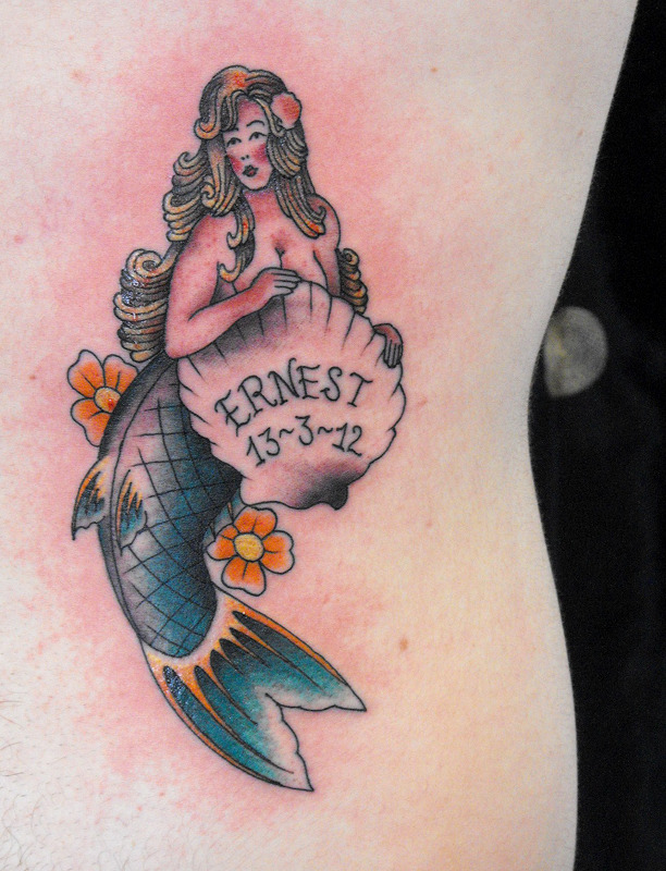 mermaids rib tattoo