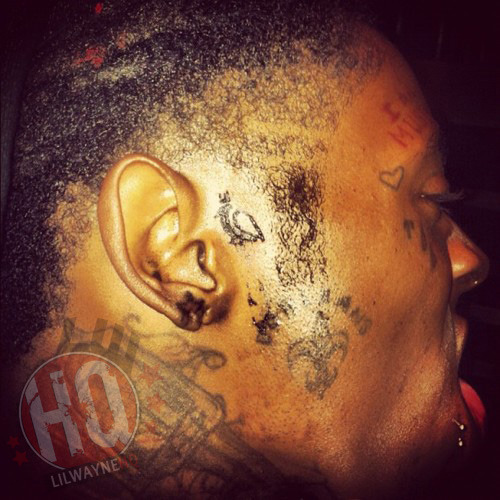 Lil Wayne has a new tattoo on the side of his face but what is it 